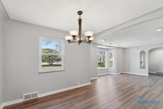 3105 W Laskey Rd, Toledo, OH 43613 - unfurnished dining area with plenty of natural light, visible vents, baseboards, and wood finished floors
