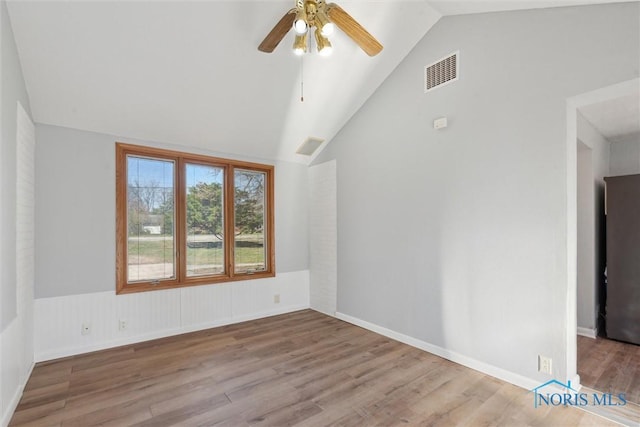 3105 W Laskey Rd, Toledo, OH 43613 - spare room with lofted ceiling, wood finished floors, visible vents, and ceiling fan