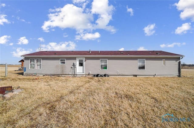 17341 Rd 139, Cecil, OH 45821 - rear view of property with a lawn