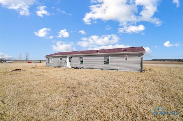 17341 Rd 139, Cecil, OH 45821 - rear view of property featuring a yard