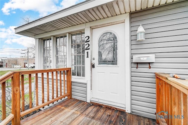 221 S Cherry St, Paulding, OH 45879 - property entrance with a wooden deck