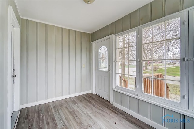221 S Cherry St, Paulding, OH 45879 - entrance foyer featuring wood finished floors and a decorative wall