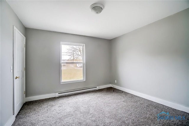 221 S Cherry St, Paulding, OH 45879 - empty room with a baseboard radiator, baseboards, and carpet flooring