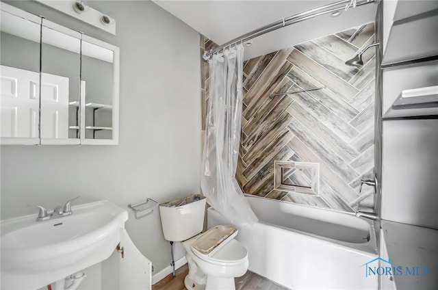 221 S Cherry St, Paulding, OH 45879 - full bath with shower / tub combo with curtain, toilet, and a sink