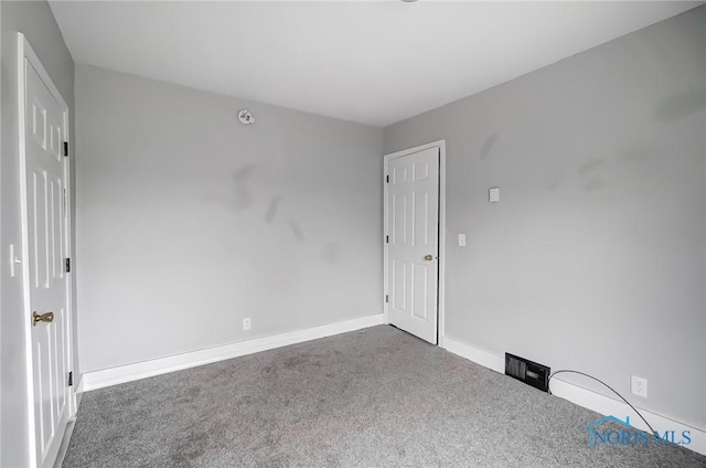 221 S Cherry St, Paulding, OH 45879 - unfurnished room with carpet floors and baseboards