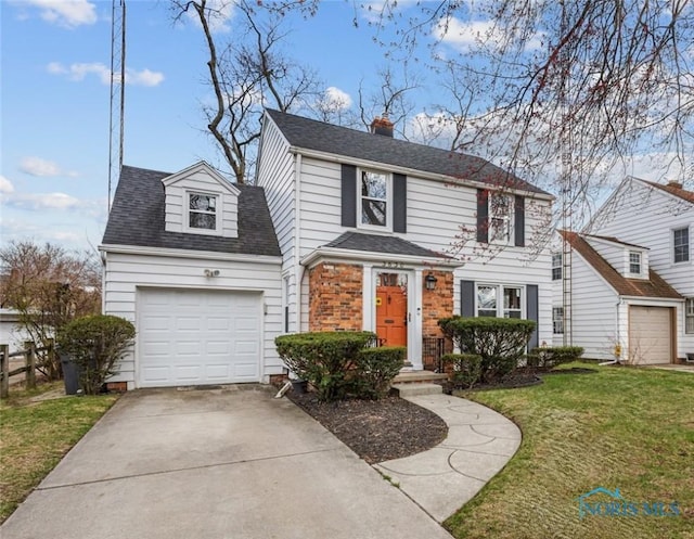 view of front of house featuring a front lawn, driveway, a chimney, a garage, and a shingled roof