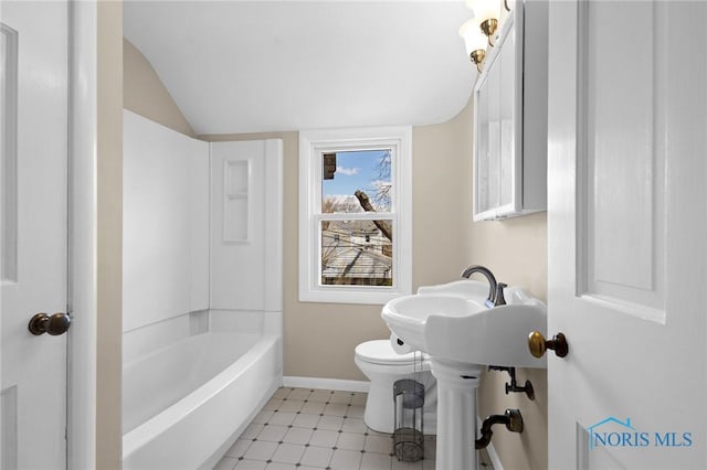 bathroom featuring vaulted ceiling, toilet, tile patterned floors, and baseboards