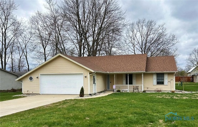 ranch-style house featuring a shingled roof, concrete driveway, covered porch, a front yard, and a garage