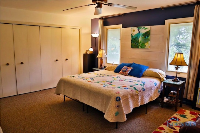 bedroom featuring a ceiling fan, a closet, and carpet