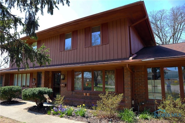 view of front of house featuring brick siding