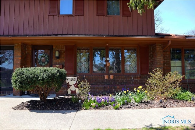 view of front of property with brick siding and covered porch