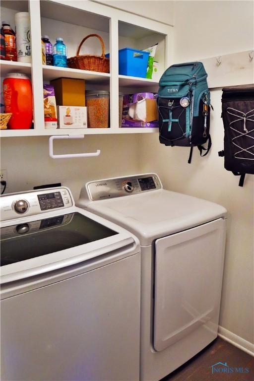 laundry room featuring washer and clothes dryer and laundry area