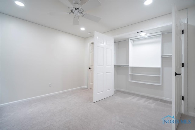unfurnished bedroom featuring baseboards, carpet flooring, and recessed lighting