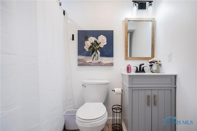 full bathroom with vanity and toilet