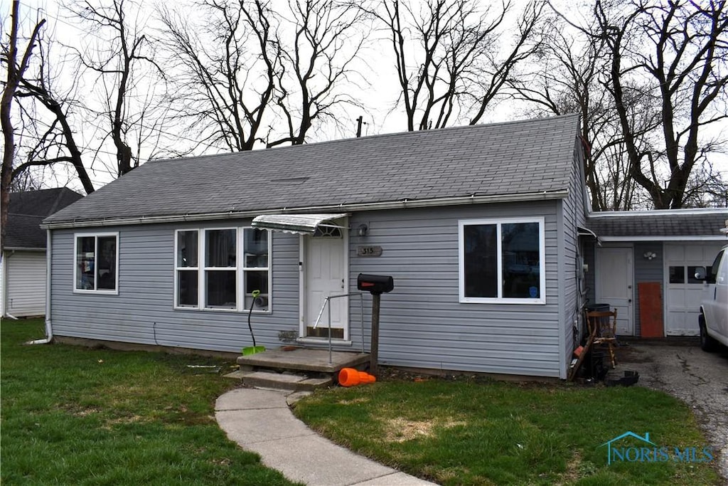 315 Locust St, Waterville, OH 43566 - view of front of property with a front yard
