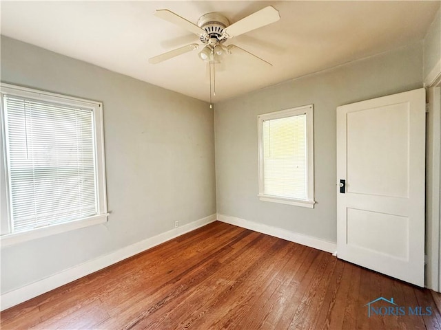 440 Union Ct, Fostoria, OH 44830 - empty room with hardwood / wood-style flooring, ceiling fan, and baseboards