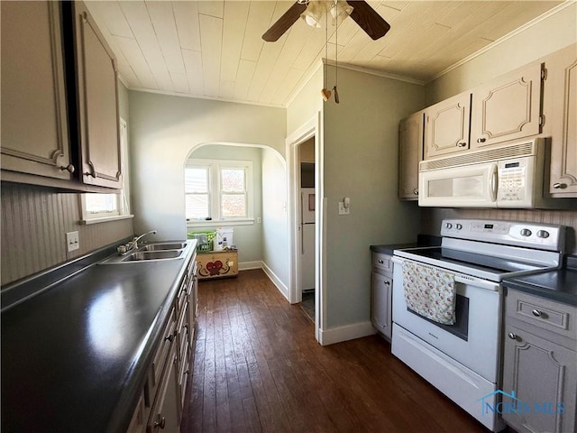 440 Union Ct, Fostoria, OH 44830 - kitchen featuring dark countertops, a sink, white appliances, ceiling fan, and dark wood-style flooring