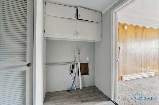 402 S 5th St, Continental, OH 45831 - laundry room with cabinet space, wood finished floors, and a baseboard radiator