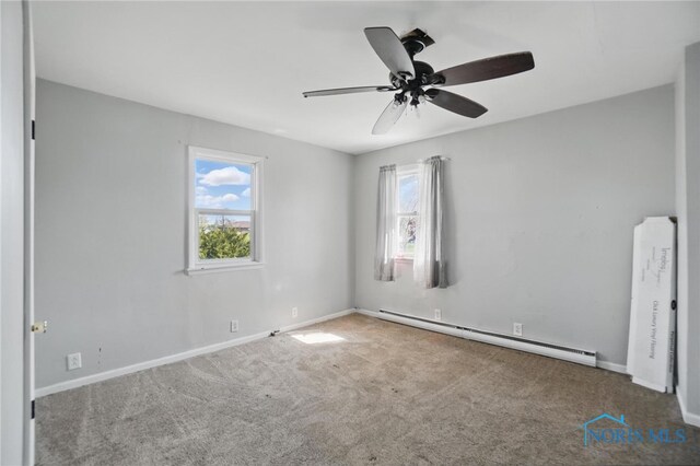 402 S 5th St, Continental, OH 45831 - unfurnished room featuring plenty of natural light, carpet floors, and a baseboard radiator