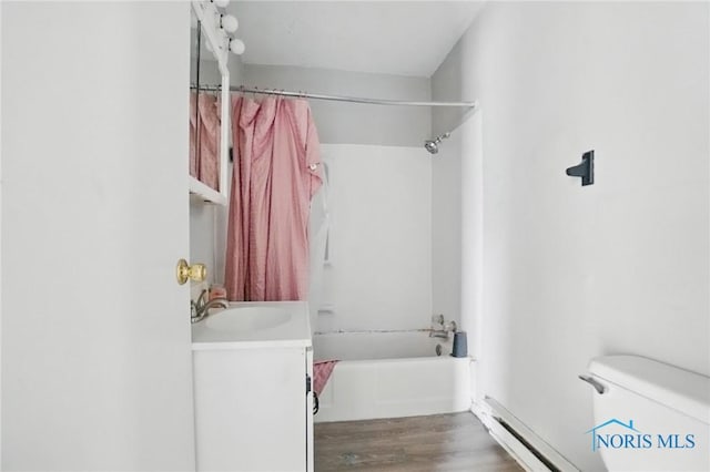 402 S 5th St, Continental, OH 45831 - full bath with wood finished floors, baseboard heating, shower / bath combo, toilet, and vanity