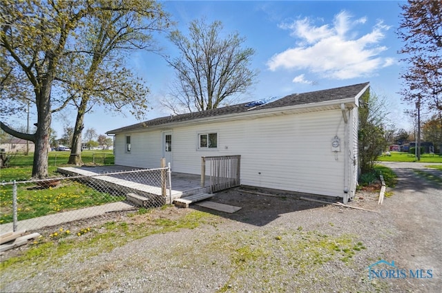 402 S 5th St, Continental, OH 45831 - rear view of house featuring fence and a wooden deck