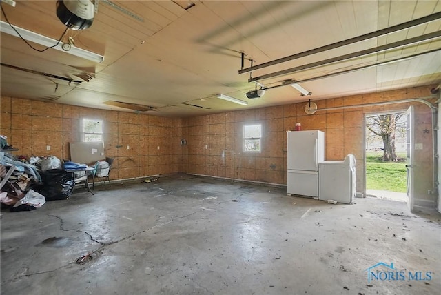 402 S 5th St, Continental, OH 45831 - garage with freestanding refrigerator and a garage door opener