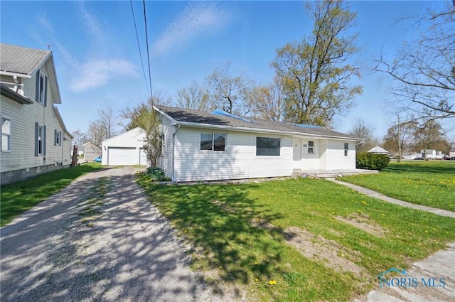 402 S 5th St, Continental, OH 45831 - bungalow-style home featuring a detached garage, an outbuilding, and a front yard