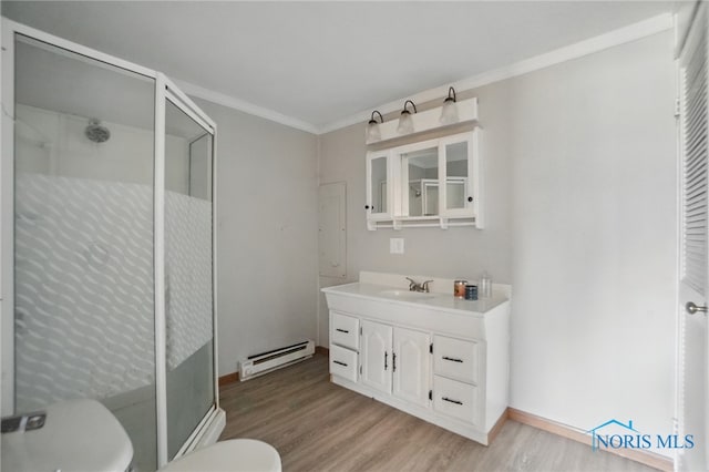 402 S 5th St, Continental, OH 45831 - bathroom with a stall shower, a baseboard heating unit, toilet, ornamental molding, and wood finished floors