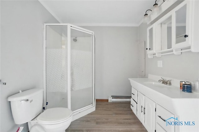 402 S 5th St, Continental, OH 45831 - full bath featuring vanity, a stall shower, wood finished floors, and a baseboard radiator
