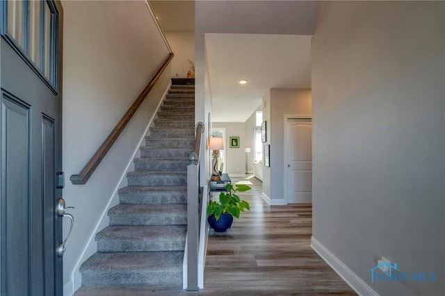 1007 Stoneleigh Rd, Perrysburg, OH 43551 - stairway featuring baseboards, wood finished floors, and recessed lighting
