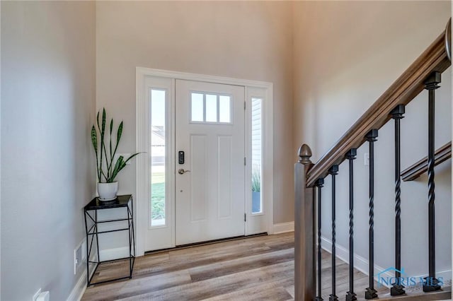 1007 Stoneleigh Rd, Perrysburg, OH 43551 - foyer entrance featuring wood finished floors, visible vents, stairway, and a high ceiling