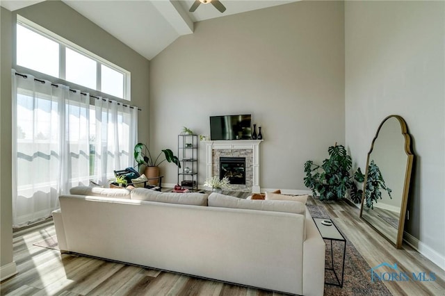 1007 Stoneleigh Rd, Perrysburg, OH 43551 - living room with baseboards, high vaulted ceiling, light wood-style floors, and ceiling fan