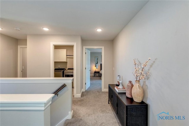 1007 Stoneleigh Rd, Perrysburg, OH 43551 - hall featuring an upstairs landing, light carpet, washer and clothes dryer, and recessed lighting