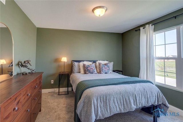 1007 Stoneleigh Rd, Perrysburg, OH 43551 - carpeted bedroom with arched walkways and baseboards