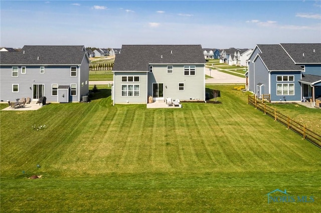 1007 Stoneleigh Rd, Perrysburg, OH 43551 - rear view of house featuring fence, a yard, a residential view, and a patio