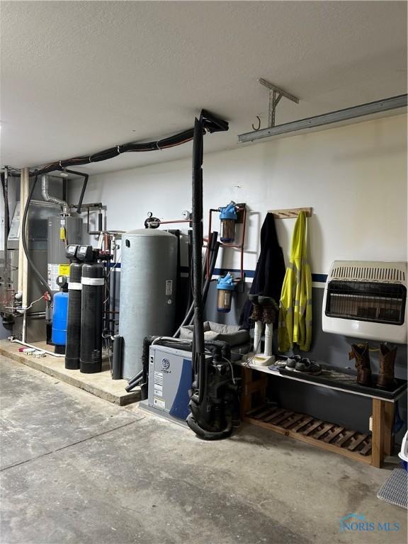 interior space with water heater and heating unit