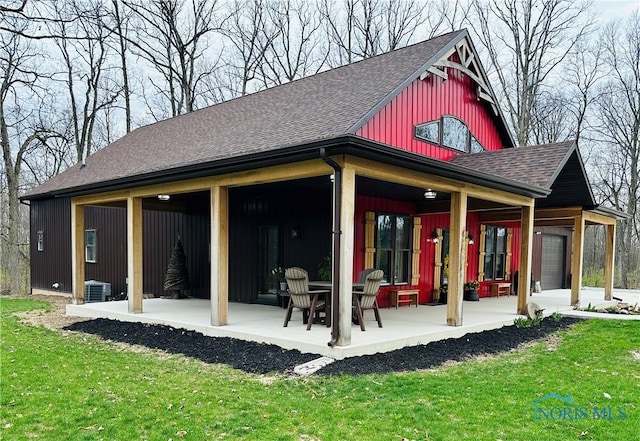 1673 Evan Dr, Defiance, OH 43512 - back of property featuring roof with shingles, a lawn, and central AC unit