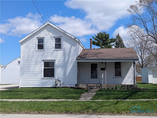 view of front of house with a porch and a front yard