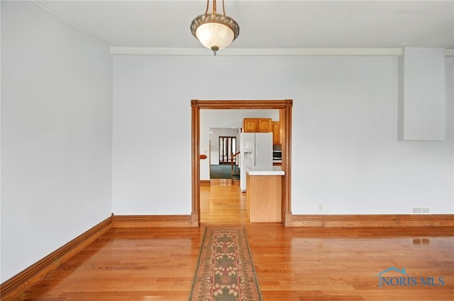 1000 Washington Ave, Findlay, OH 45840 - spare room with light wood-style floors, baseboards, and ornamental molding