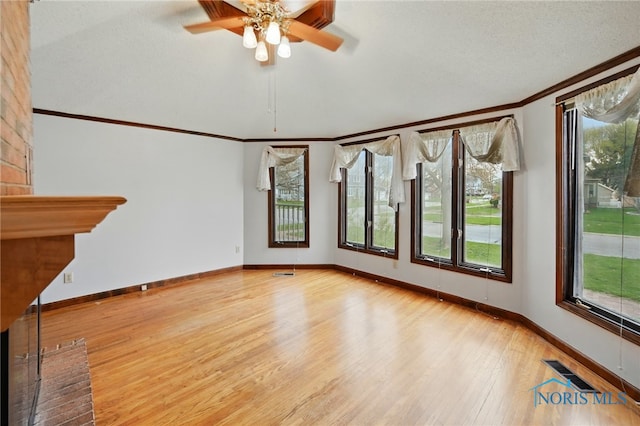 1000 Washington Ave, Findlay, OH 45840 - unfurnished room featuring ornamental molding, light wood-style floors, healthy amount of natural light, baseboards, and ceiling fan