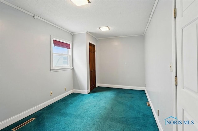 1000 Washington Ave, Findlay, OH 45840 - carpeted empty room featuring baseboards, a textured ceiling, and crown molding