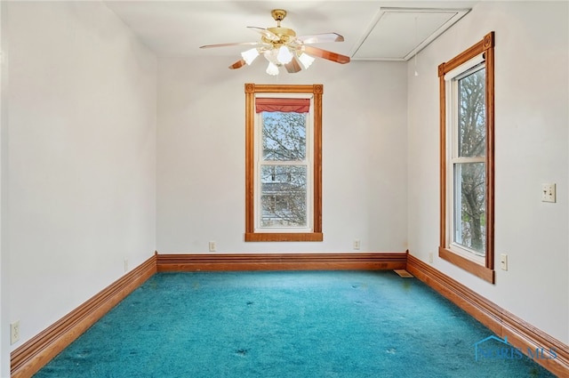 1000 Washington Ave, Findlay, OH 45840 - carpeted empty room featuring attic access, healthy amount of natural light, baseboards, and ceiling fan