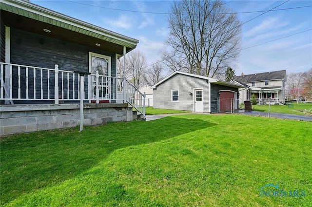 1000 Washington Ave, Findlay, OH 45840 - view of side of property featuring a porch, an outbuilding, a garage, and driveway