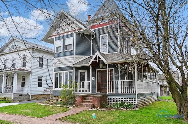 1000 Washington Ave, Findlay, OH 45840 - victorian house with covered porch, a front lawn, and roof with shingles