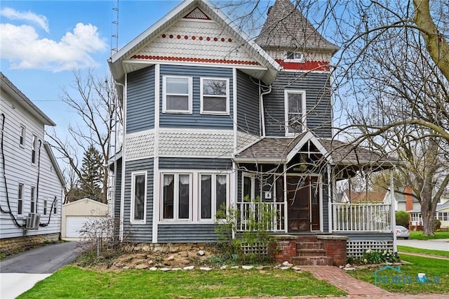 1000 Washington Ave, Findlay, OH 45840 - victorian house with an outbuilding, a garage, and covered porch