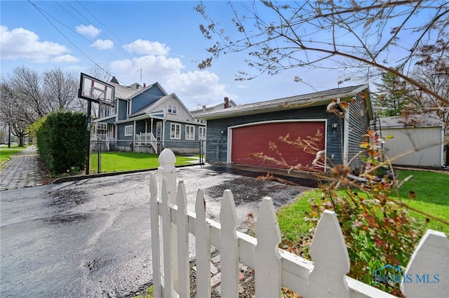 1000 Washington Ave, Findlay, OH 45840 - view of front of home with an outdoor structure and a garage