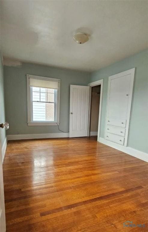 740 E Main St, Ottawa, OH 45875 - unfurnished bedroom with baseboards and wood finished floors