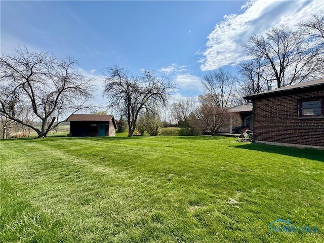 1965 Colwell Cir, Defiance, OH 43512 - view of yard with an outdoor structure and a storage shed