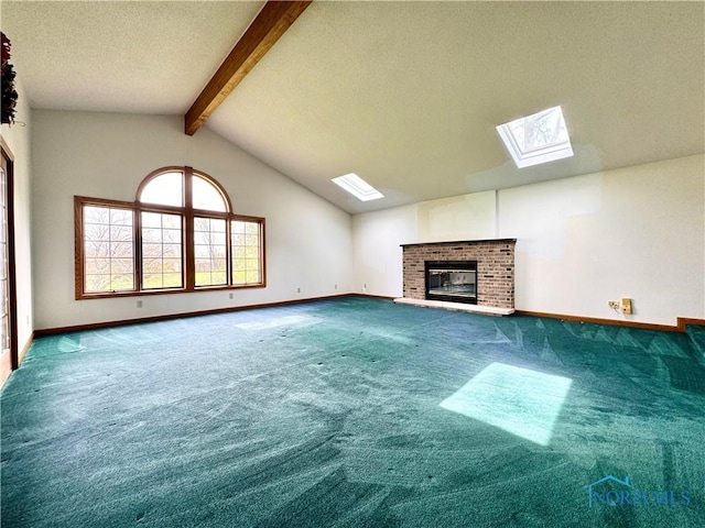 1965 Colwell Cir, Defiance, OH 43512 - unfurnished living room featuring a fireplace, baseboards, carpet, and vaulted ceiling with skylight