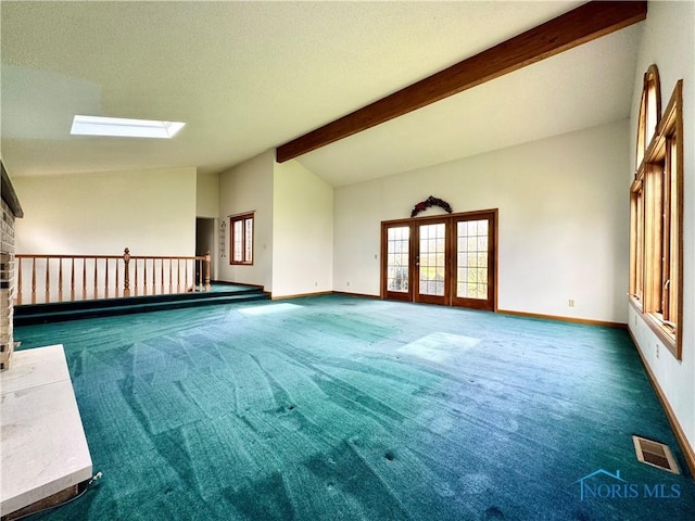 1965 Colwell Cir, Defiance, OH 43512 - carpeted empty room featuring lofted ceiling with skylight, visible vents, baseboards, and french doors
